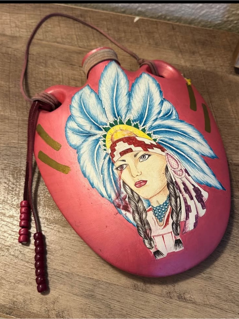 Hand-Painted Native American Water Canteen
Stoneware Feathers